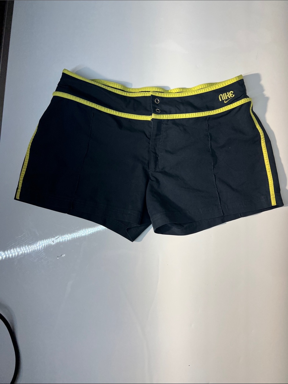 Nike Women's Black Athletic Shorts with Yellow Trim